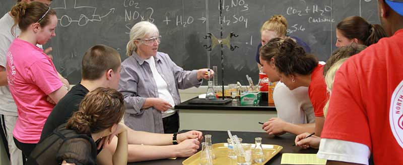 Faculty member and students in a science classroom at Keuka College